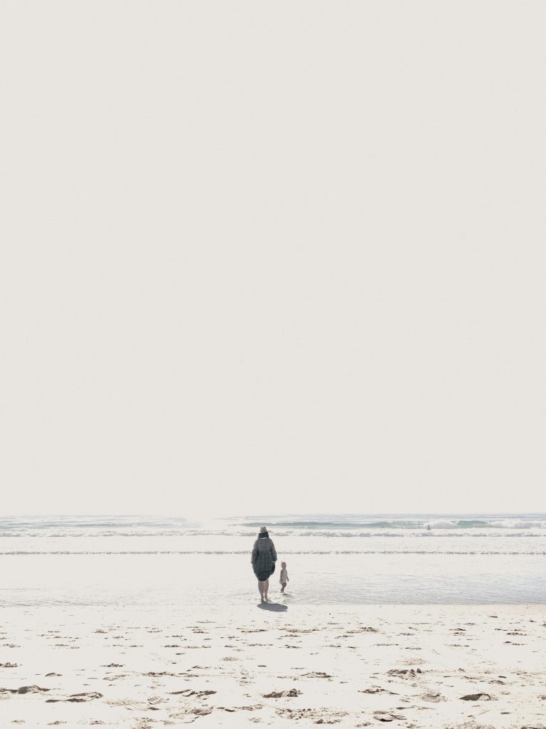 a  mother and child on the beach, (mother wounds)